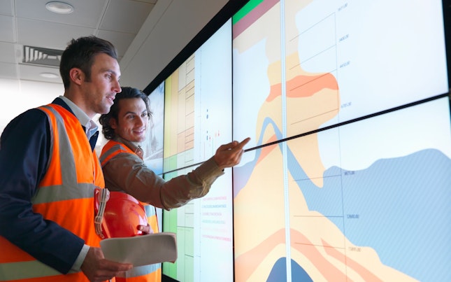 Geologists Checking Data on a Screen
